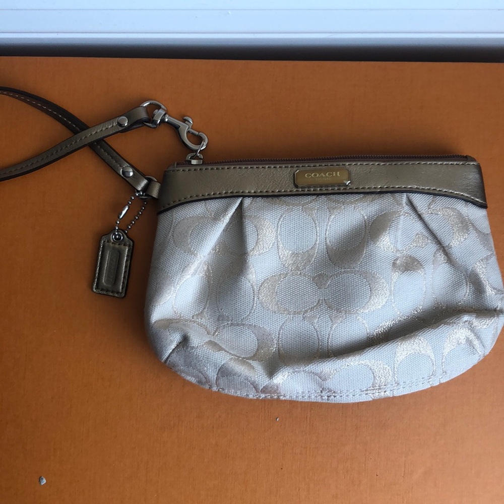 Coach cream and gold wristlet
